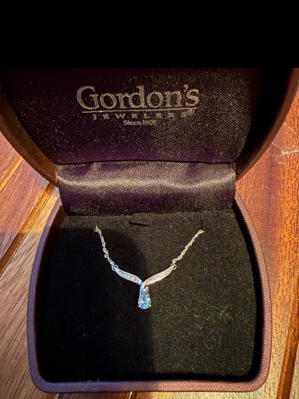 Gordon's Jewelers aquamarine and diamond white gold necklace.